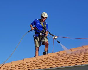 Pressure cleaning house with industrial pressure cleaner and safety equipment